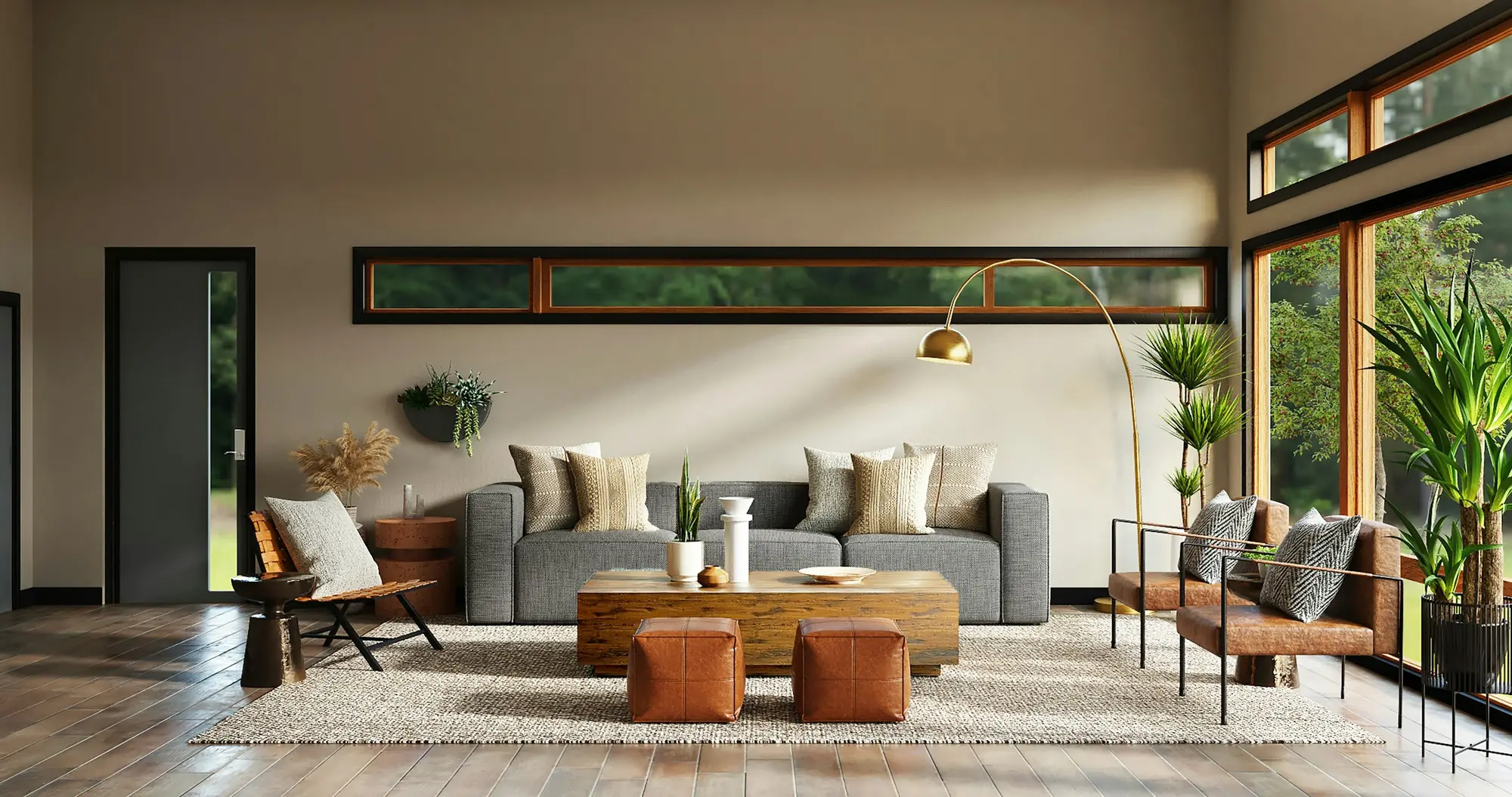 Sunlit living room with a grey modular sofa, reclaimed wood coffee table, tan leather poufs, brass arc lamp and leather sling chairs