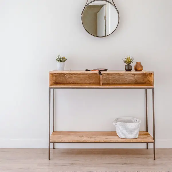 Oak console table with a round leather-strap mirror