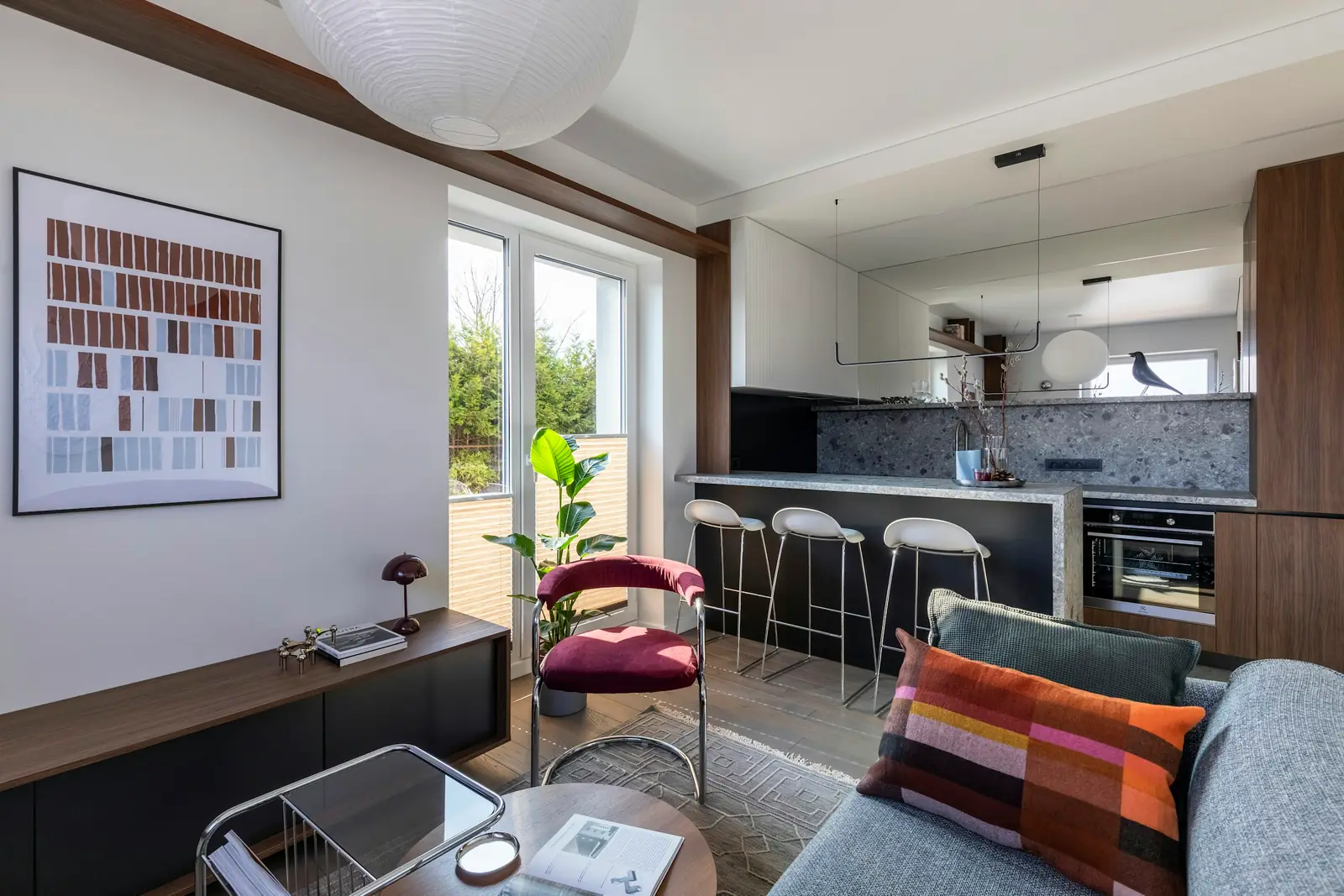 Open-plan apartment with a living area flowing into the kitchen