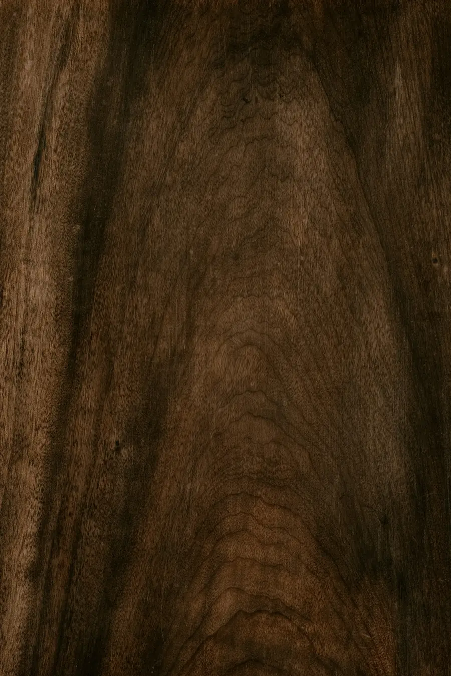 Close-up of deep brown sheesham wood grain