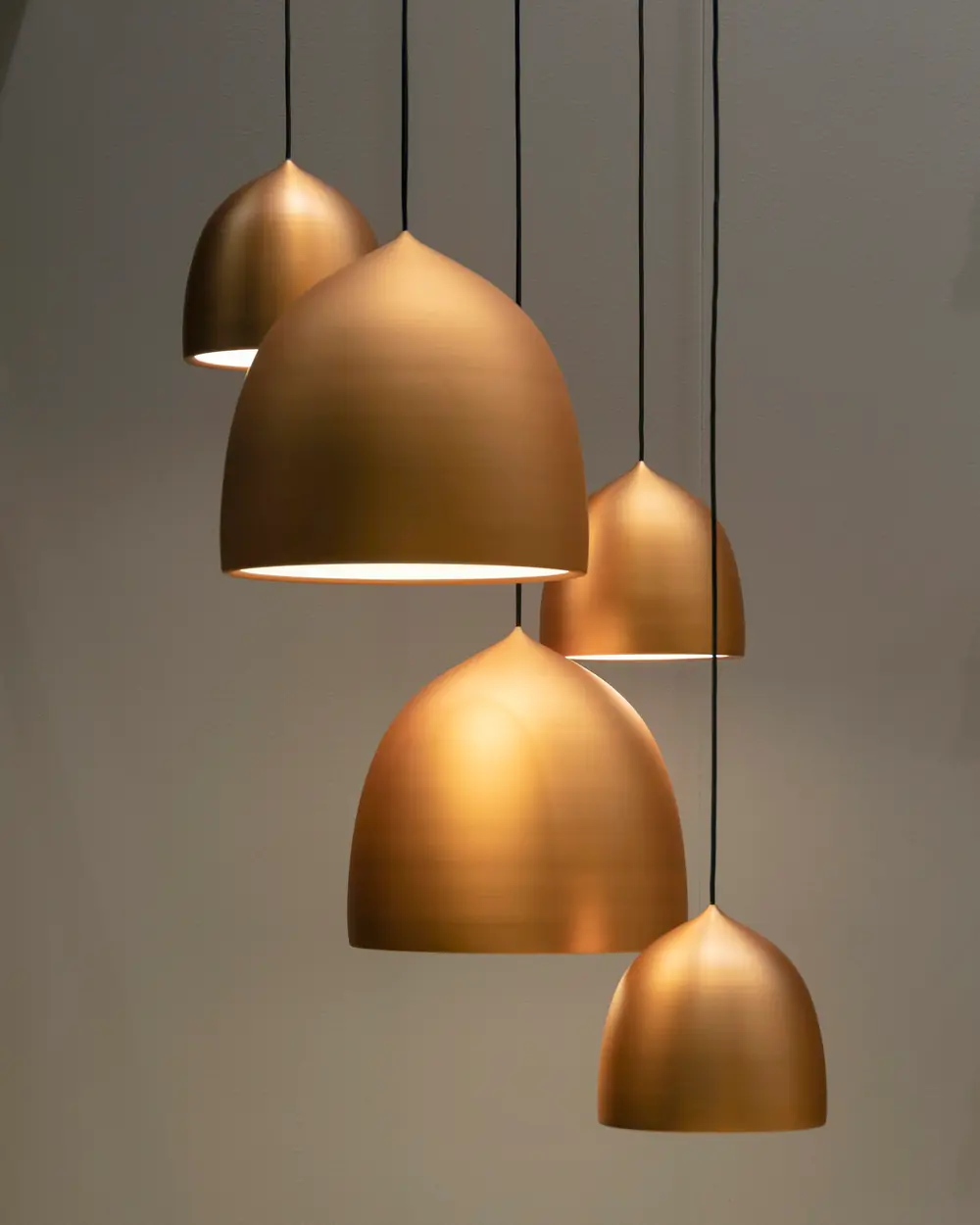 Cluster of five spun copper-brass dome pendant lights